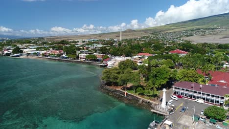 cinematic aerial drone shot of the historic front street area in lahaina, maui, prior to 2023 maui wildfires