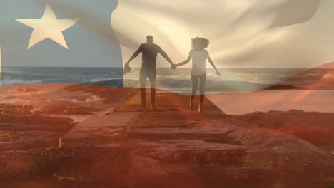 animation of flag of chile over african american couple at beach