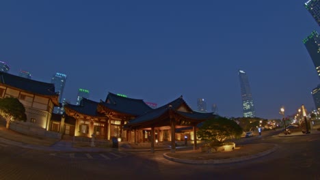 asian traditional national park architecture buildings in the evening night city town urban style, chinese, japanese, oriental skyscrapers and constructions wide angle view street lights panorama