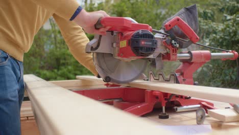 wood planks are being cut in the middle