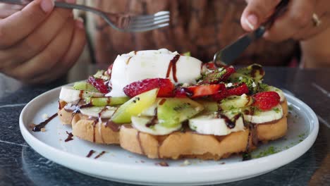 delicious waffle with ice cream and fruits