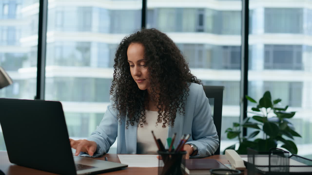 Woman conducting online consultation using laptop close up. Girl working office