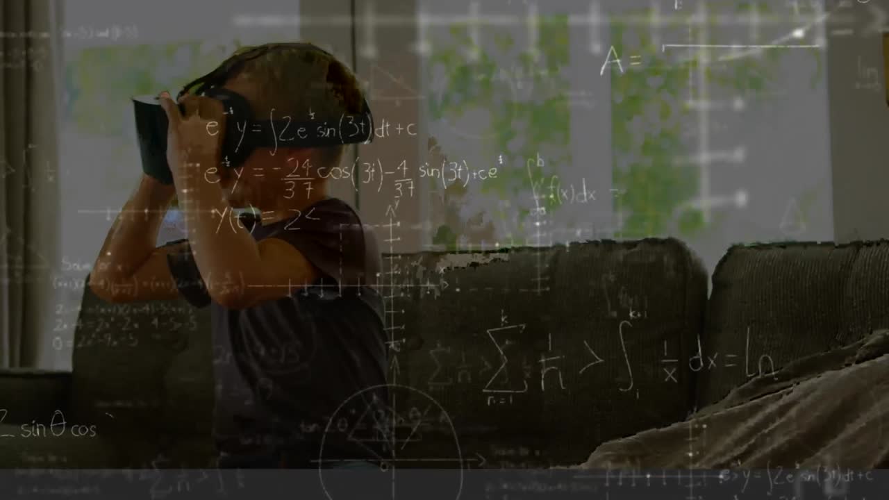 Little boy sitting on a couch wearing a virtual reality headset