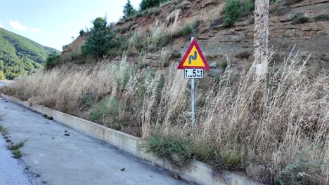 road with sharp turns dangerous uphill infrastructure greece greek letters