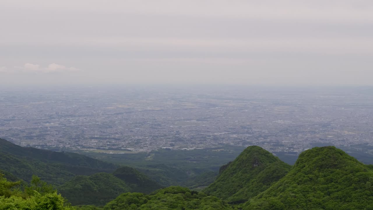 Panning shot over Kanto Plain on cloudy day from high above viewpoint