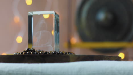 rack focus on tibetan meditation beads and defocussed background