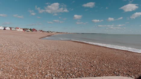 beautiful view of calm and empty shingle beach in pevensey in south england in slow motion