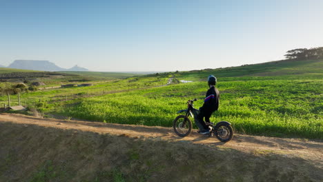 person riding a dirt bike on a dirt road