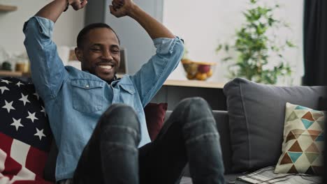 Extremely-happy-man-watching-TV