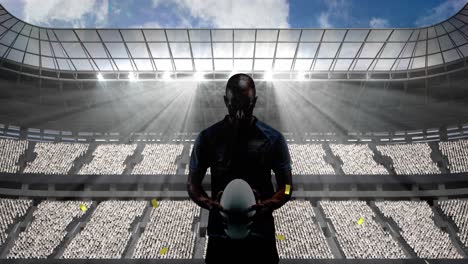 golden confetti falling over silhouette of male rugby player against sports stadium