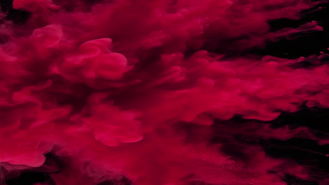 Vibrant Red Ink Explosion in Water Against Black Background