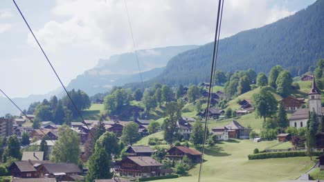 Long-shot,-ski-lift,-Switzerland,-valley,-aerial,-rising,-mountains,-low-to-mid-height