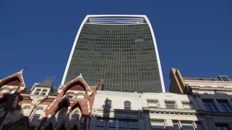 looking up at 20 fenchurch street skyscraper from eastcheap street in central london, uk