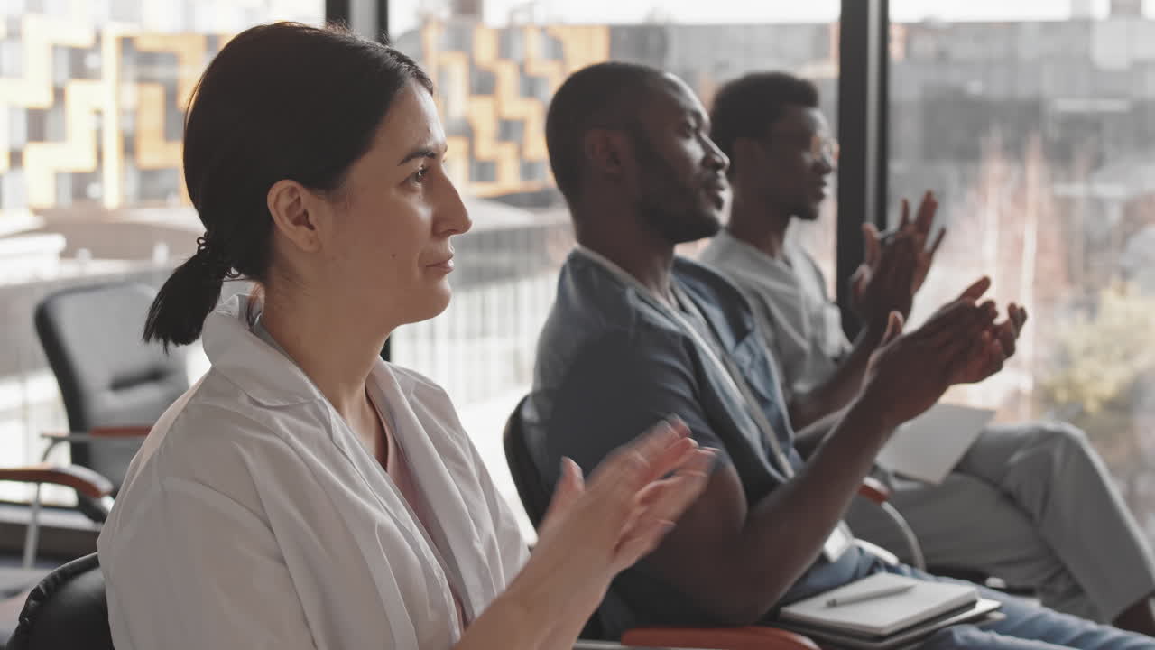 Medical Professionals Applauding at a Conference