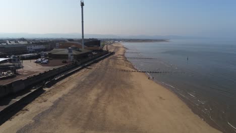 Popular-seaside-Rhyl-funfair-resort-town-aerial-view-above-coastal-beach-waterfront