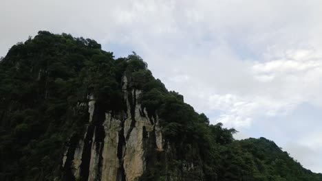 beautiful drone shot of lush green asian mountains in high altitudes on a grey day