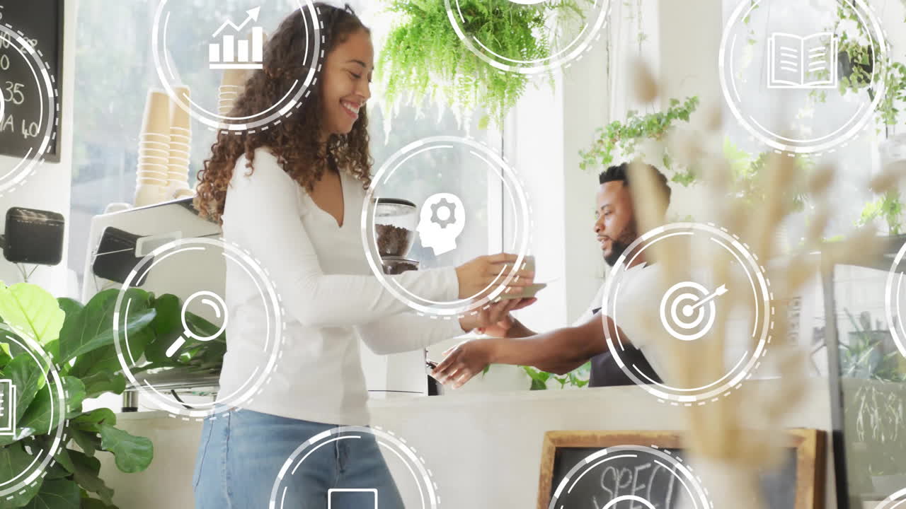 animación de iconos digitales sobre diversas personas en la cafetería