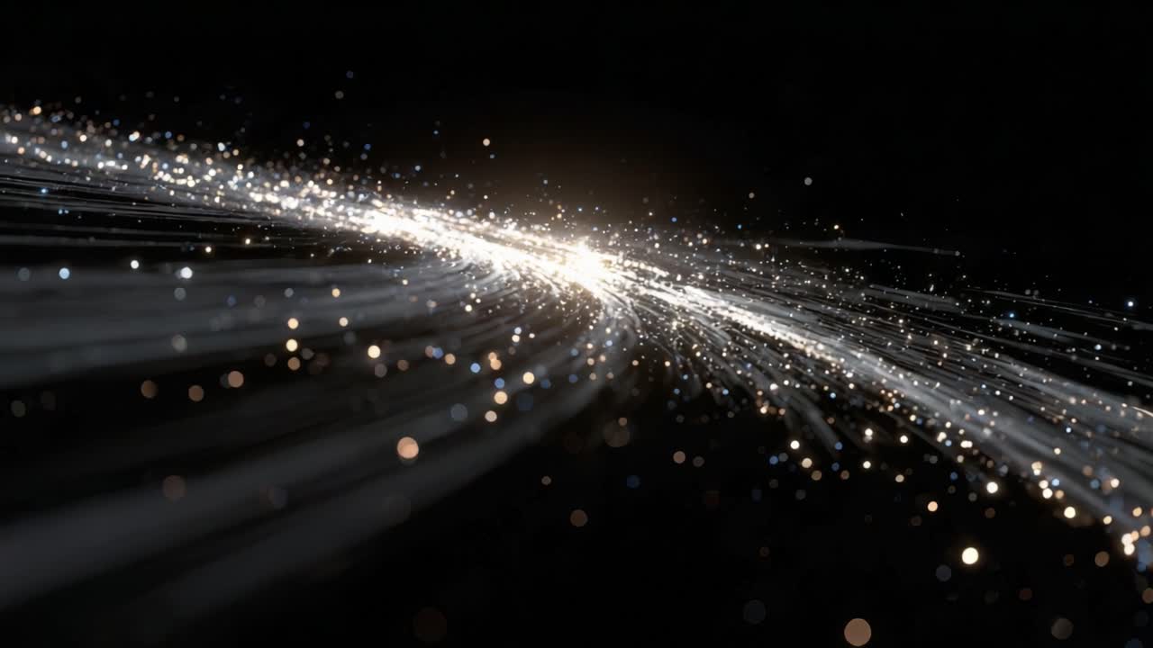 Golden and silver glitter particles flowing in a shimmering stream on a black background, creating an elegant and dynamic bokeh effect with glowing light streaks for a luxury feel