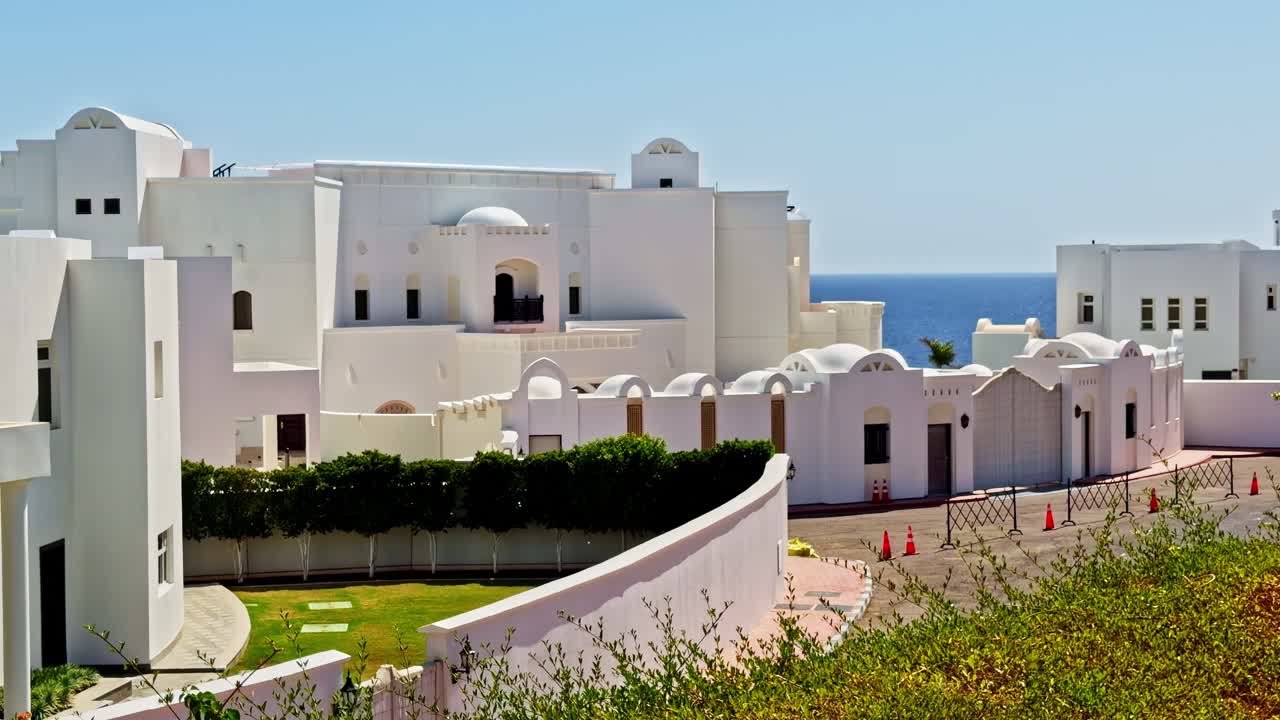 Sunlit white buildings by sea in Sharm El-Sheikh, serene and peaceful