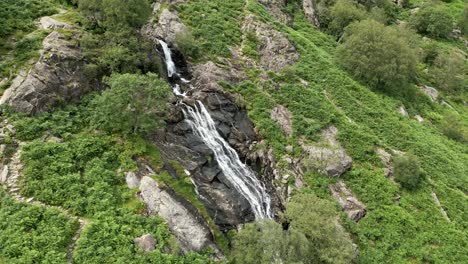 drone aerial footage of the taylor gill force waterfall at borrowdale, seathwaite and is one of the highest waterfalls, in the national park lake district united kingdom