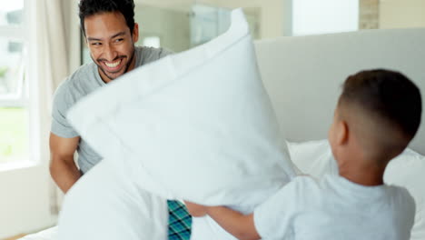 Pillow-fight,-happy-dad-and-boy-kid-in-bedroom