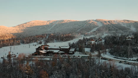 Low-Fly-Over-Aerial-Shot-of-Saddleback-Maine-Ski-Area-during-Beautiful-sunset