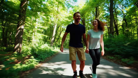 couple roller skating in a park
