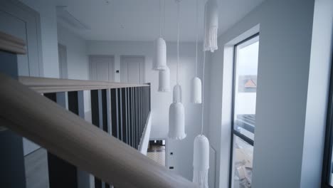 interior design stylish wooden stairs inside the house with modern wooden railings and walls decorated with trendy lamps. modern stairway or staircase inside in modern house interior