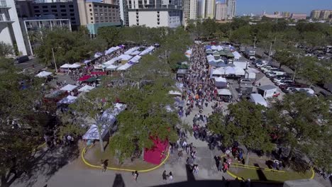 4k aerial drone video of farmers market at waterfront park in st