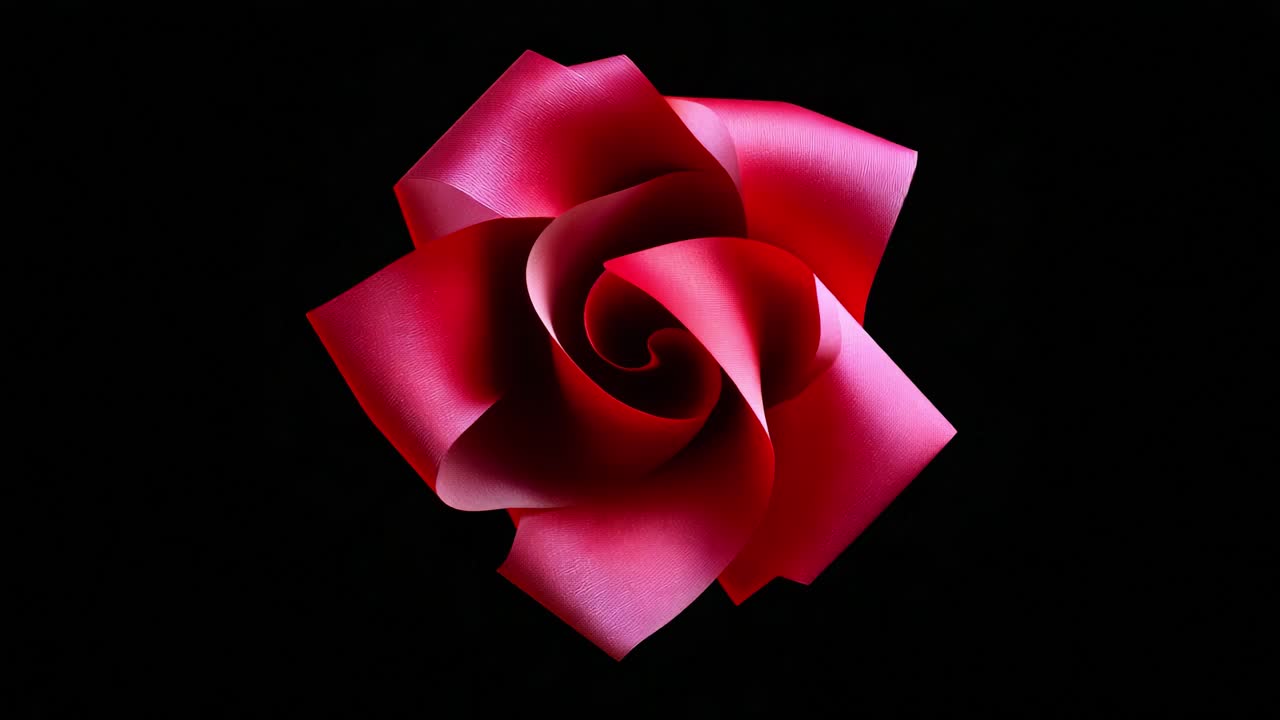 Un primo piano accattivante di una bellissima rosa rossa, che emana eleganza e grazia con i suoi delicati petali, su un misterioso sfondo nero che ne esalta i colori vivaci e la texture