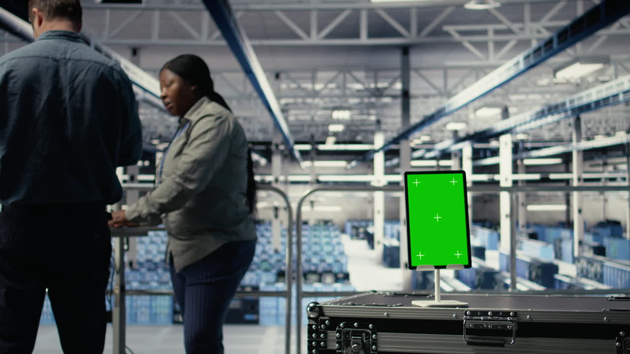 Data Center Workers Monitor Ai Processes With Isolated Screen Tablet