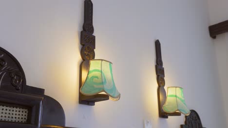 Close-Shot-Of-Hanged-Lanterns-Between-Two-Single-Beds-In-Bedroom