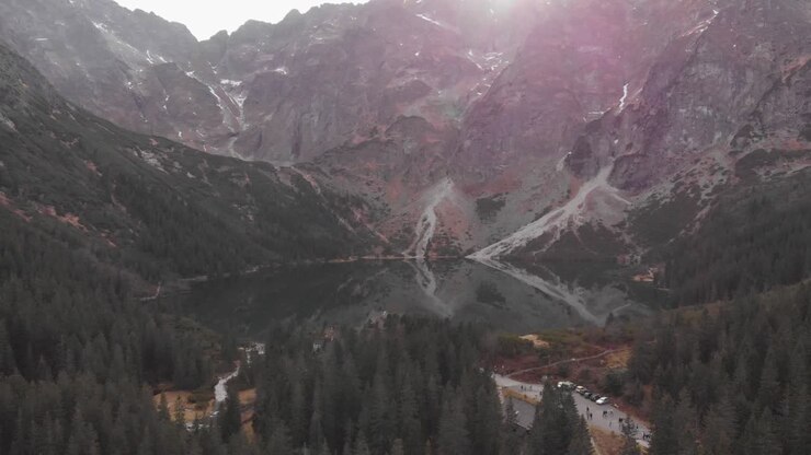 Amazing drone shoot entering the Morkie Oko lake in the National Park of Tatry, Poland