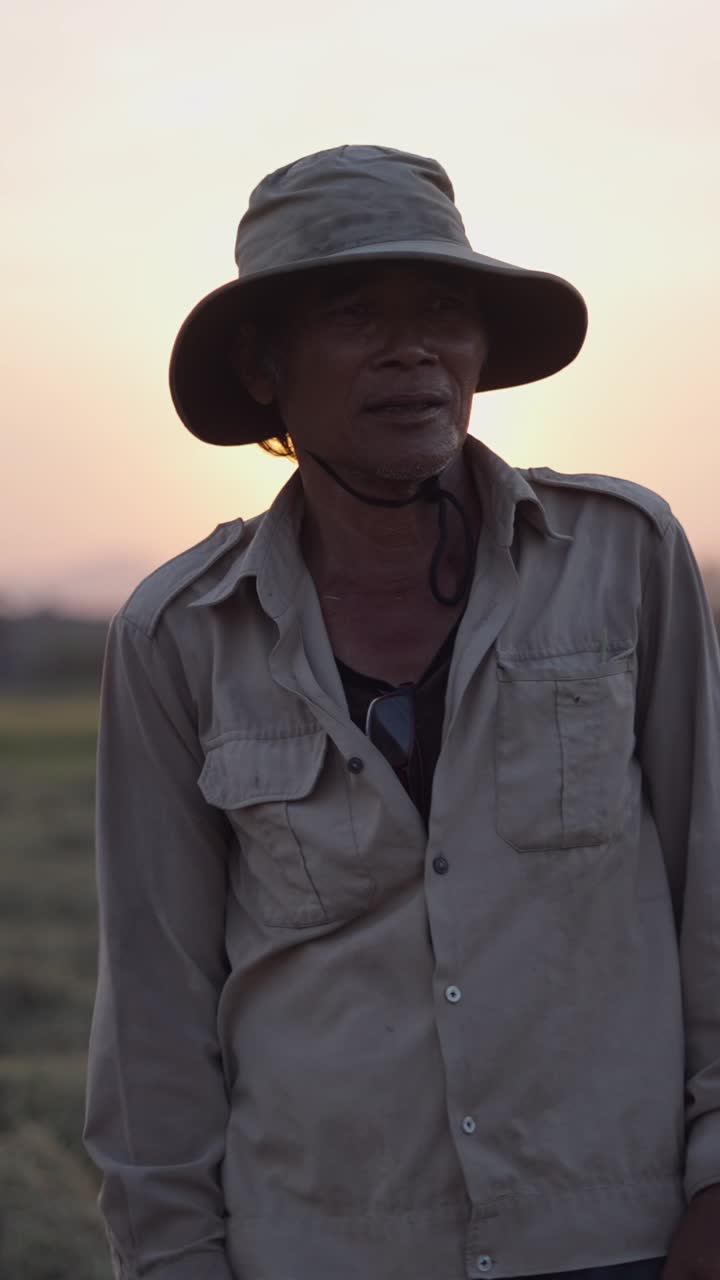Portrait of an elderly farmer during sunset