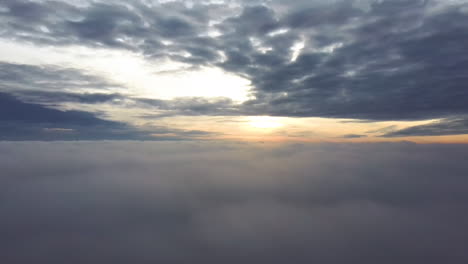 fly above the clouds during sunrise