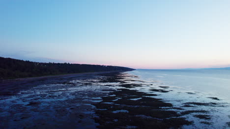 drone view above the saint lawrence river in gaspésie along the coast