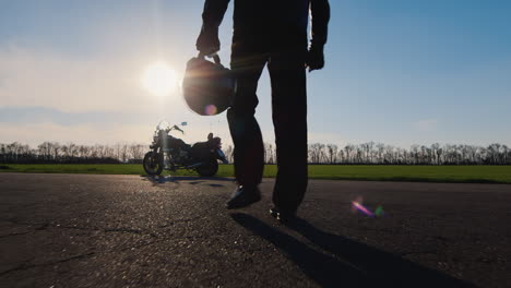 Forward-To-Dream-And-Travel-Biker-With-Helmet-In-His-Hand-Goes-To-The-Motorcycle-Hd-Video