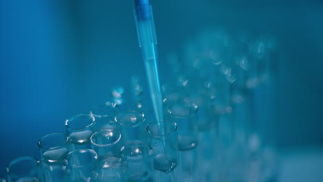 pipetting liquid into test tubes