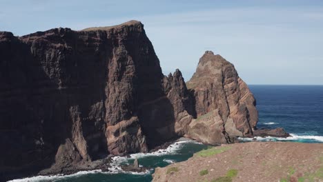 epic cliffs and rocks with vast ocean in background during sunny day