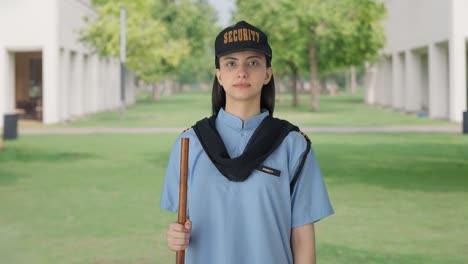 indian female security guard standing on duty