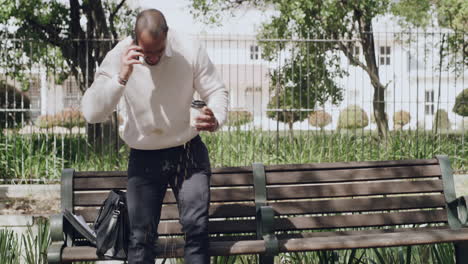 clumsy business man talking on phone call