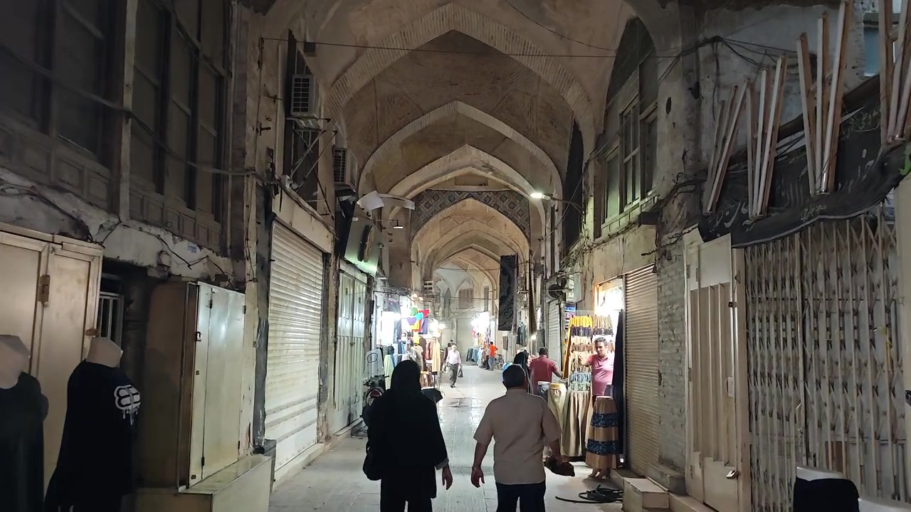 People Walking Through a Traditional Middle Eastern Bazaar