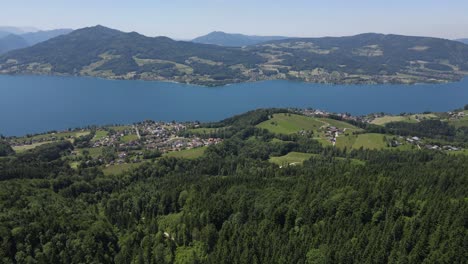 alpine lake with forest and mountains at attersee in austria