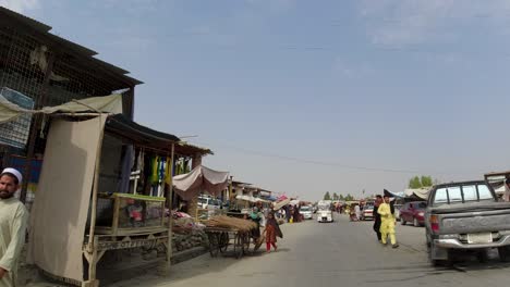 riding through the local bazaar