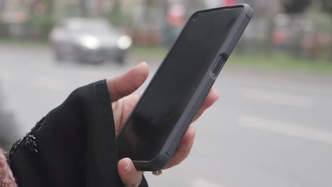 woman using smartphone on the street