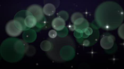 falling green round bokeh and glitters on fashion background