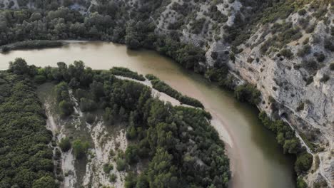 drone video flying over nestos winding river greece natural park sunset cliffs