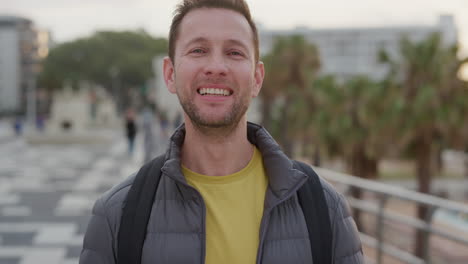 portrait-happy-young-man-tourist-laughing-enjoying-successful-vacation-travel-indepenent-caucasian-male-in-city-waterfront