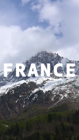 Vertical-Video-Of-Snowy-Mountain-Landscape-In-Alps-In-France-With-Animated-Graphic-Spelling-Out-France