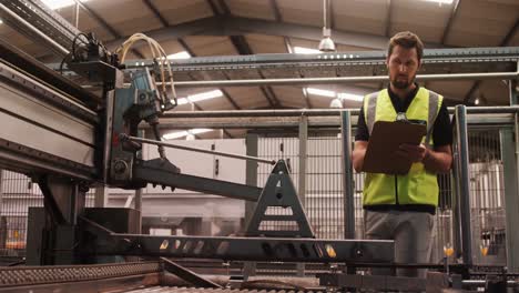 engineer maintaining record in clipboard